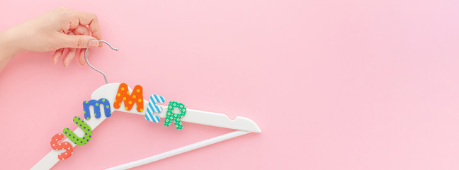White hangers with summer text pink background