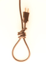 concept of energy dependence: a blurred silhouette of a hinge loop made of an electric cord with a plug, a toning, a haze