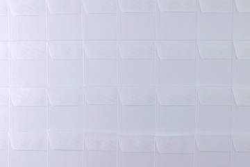 rows of blank white envelopes on desk in office, short focus, toning