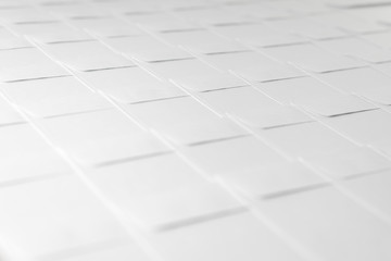 rows of blank white envelopes on desk in office, short focus, toning