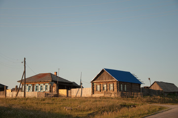 Fototapeta premium Siberian village. Houses on the hill.