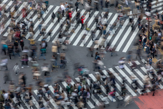 Blurred Motion of People Crossing a Busy Tokyo Street