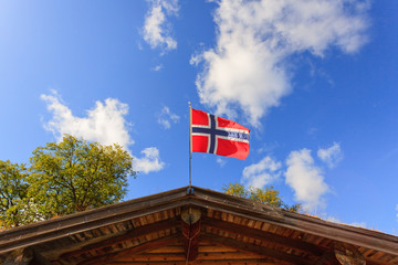 The norwegian flag against blue sky