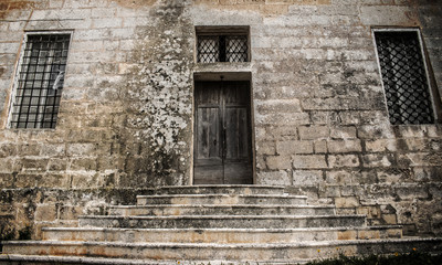 Old Door in Limestone Wall