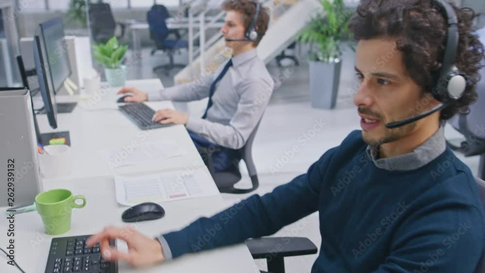 Aufkleber Team of Handsome and Beautiful Diverse Multicultural Customer Service Operators Working at a Busy Modern Call Center with Specialists Wearing Headsets and Actively Taking Calls. 