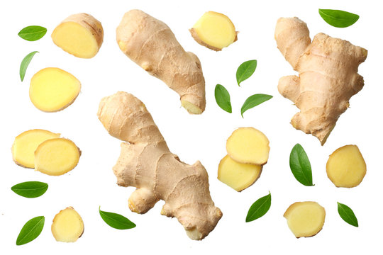 sliced ginger with leaves isolated on white background top view