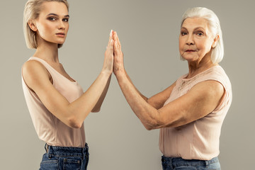 Pleasant good looking nice women standing together