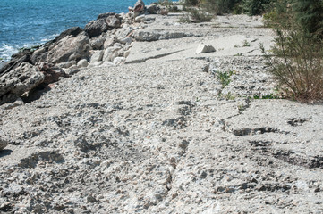 Destroyed by sea water erosion process seaside promenade concrete cover surface