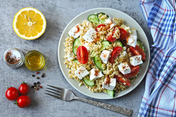 Superfood vegetarian salad with bulgur and feta. Lemon bulgur salad. Middle Eastern cuisine. Tabbouleh salad.
