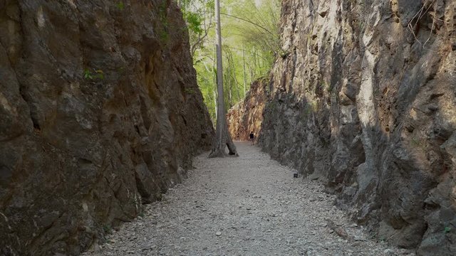 Walk along the path,Hellfire Pass Memorial Museum is the name of a railway cutting on the former Burma Railway (Death Railway) in Thailand which was built with forced labour during the Second World Wa