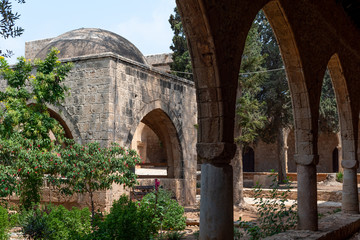 Fototapeta na wymiar View of the arbor from the outdoor corridor of the monastery. Ayia Napa Monastery. Cyprus.