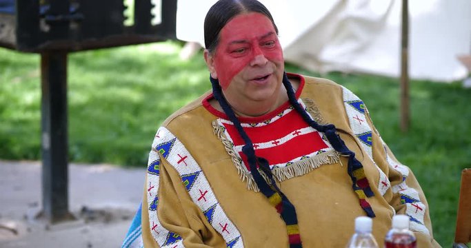 Native American Indigenous Indian tribe chief at the willage, 4K