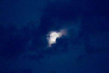 Naklejka na ściany i meble Bright night sky with moon and clouds