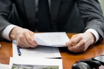 Close-up of people hands during discussion of business-plan