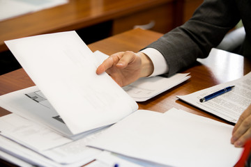 Close-up of people hands during discussion of business-plan