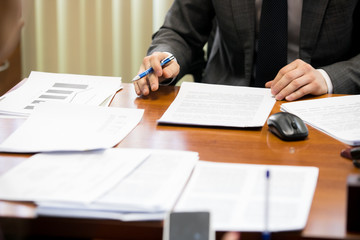Close-up of people hands during discussion of business-plan