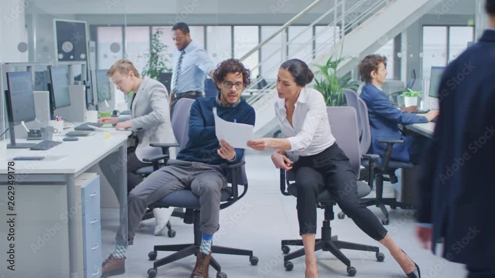 Poster Diverse Team of Business Managers and Specialists Work on Desktop Computers with Two Rows of Tables Side by Side. Young and Motivated Business people in Modern Open Office.