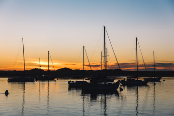 Fototapeta na wymiar Sailing boat on the sea at sunset