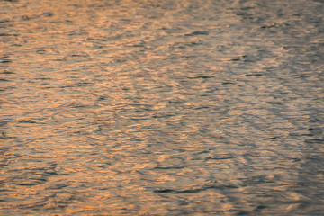 beautiful water wave pattern sunset with nice harmonic structure and reflections