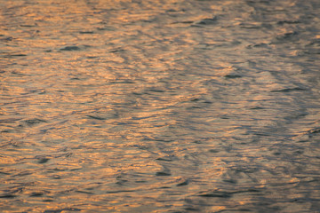 beautiful water wave pattern sunset with nice harmonic structure and reflections