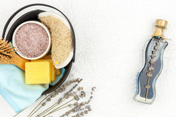 Natural herbal spa cosmetics with lavender extract - soap, salt, towel, massage brush, washcloth