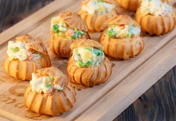 profiteroles with vegetable filling and tomatoes