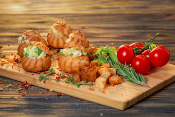 profiteroles with vegetable filling and tomatoes