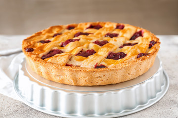 Tasty cherry pie on table