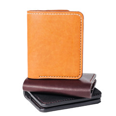 Leather accessories on a white background, wallets, coin boxes and straps, isolated