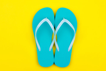 Mint Swimming Slippers on a yellow background