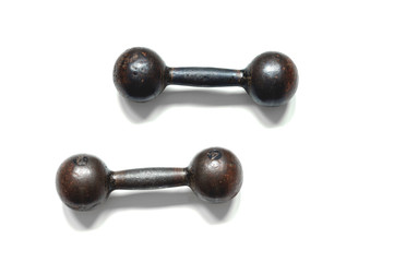 Two metal brutal dumbbells on a white background, top view close-up.