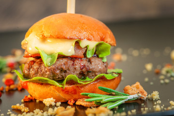 Burger with meat and lettuce