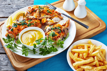 Aussie Chicken breasts topped with melted cheese