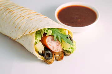 tortilla wraps with sausage and vegetables
