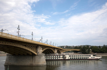 River boat and Bridge Danube River Budapest Hungary in Summer