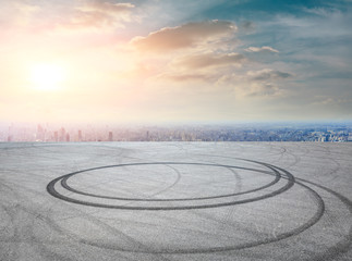 Shanghai city skyline and asphalt race track ground scenery at sunrise