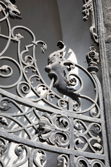 Iron Gates with decoration of human head vomitting budapest Hungary