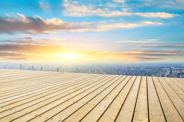 Fototapeta na wymiar Shanghai city skyline and wooden platform with beautiful clouds scenery at sunset