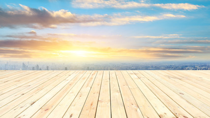 Fototapeta na wymiar Shanghai city skyline and wooden platform with beautiful clouds scenery at sunset