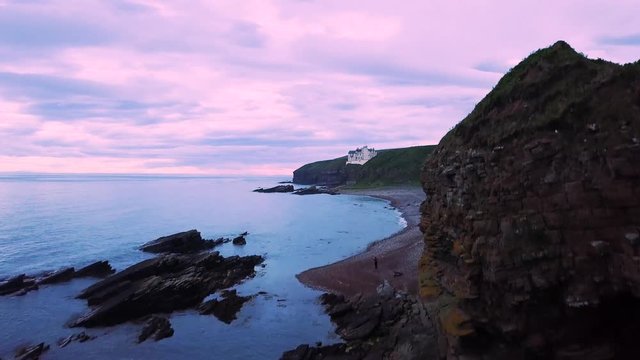 Castle in the Scottish Highlands at sunset - Dunbeath (Aerial Shot)