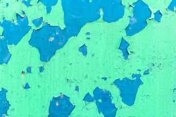 Green old cracked rusty damaged painted metal background texture close-up