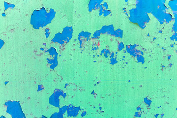 Green old cracked rusty damaged painted metal background texture close-up