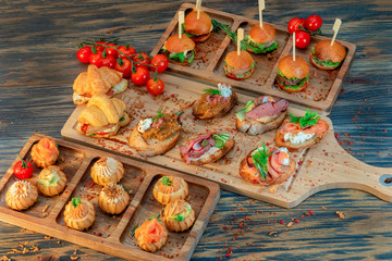 buffet with profiteroles, croissants, meat rolls