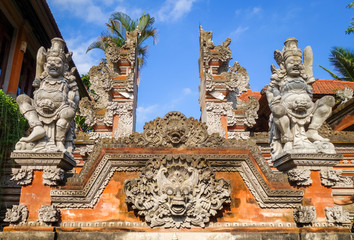 Statues on a temple entrance door, Ubud, Bali, Indonesia