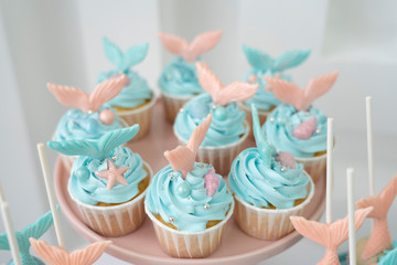 Mermaid cupcakes and cookies in pink and turquoise colors