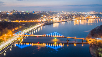 aerial night city view, luminous buildings and bridge.  Drone shot