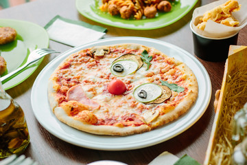 Funny face pizza for kids in a restaurant.