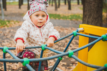 Concept of children life. Lifestyle of child, baby girl at park  