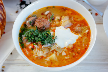 Mastava - uzbek rice soup on white table.