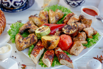 Meat plate - grilled kebabs from chiken meat, with grilled vegetables.